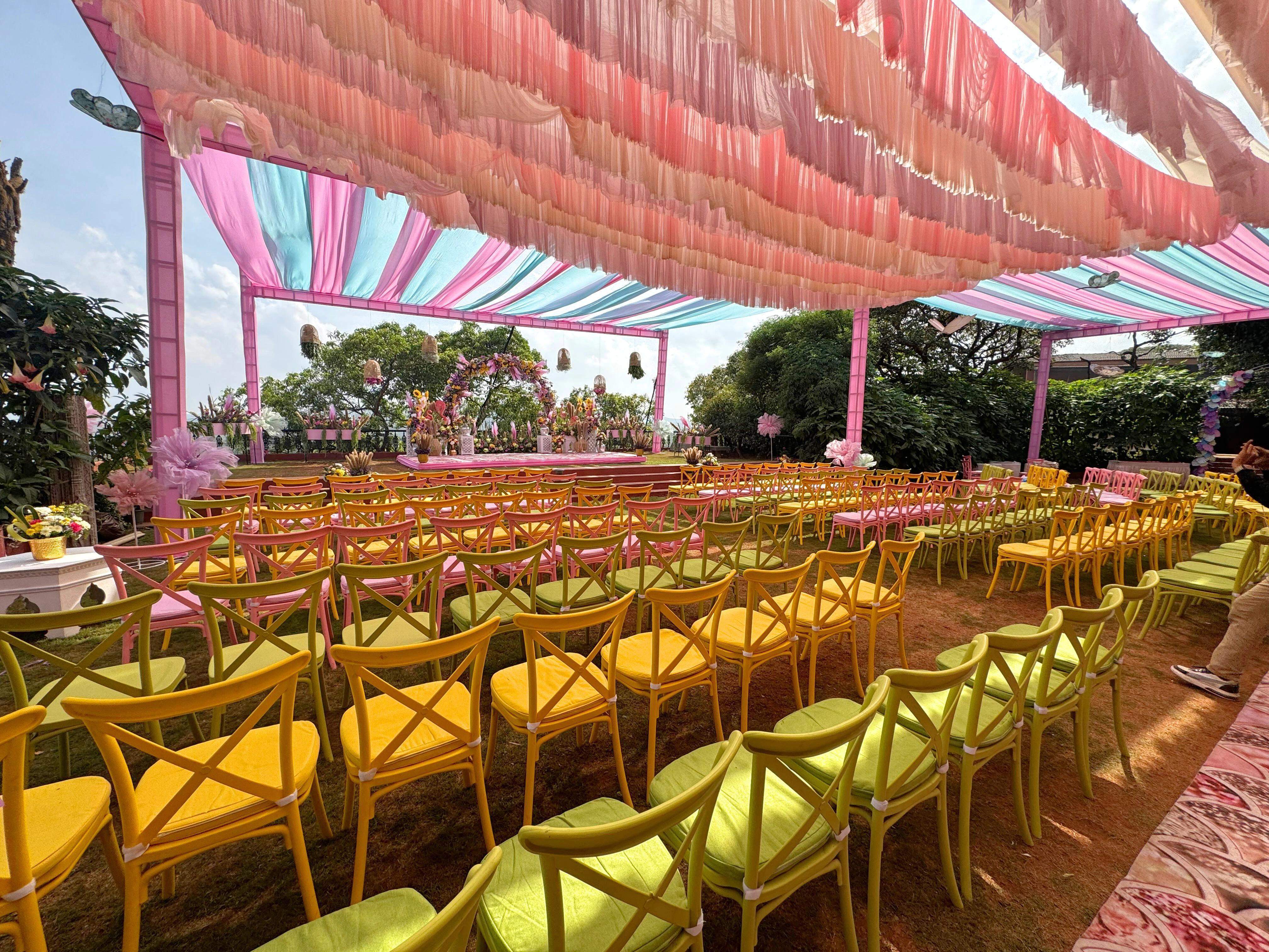 Colorful outdoor seating for a wedding reception at Ramsukh Resort, overlooking the valley.